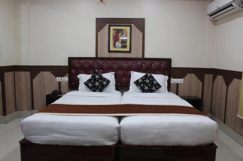 Imagen de la habitación del Hotel Gokul Plaza. Foto 17