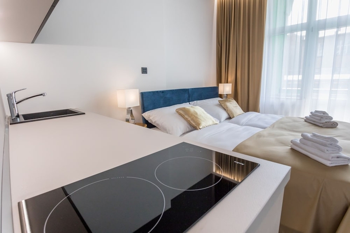 Imagen de la habitación del Hotel Golden Apartments. Foto 13