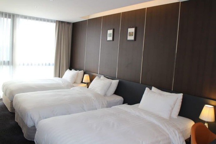 Imagen de la habitación del Hotel Golden Daisy Seogwipo Ocean. Foto 11