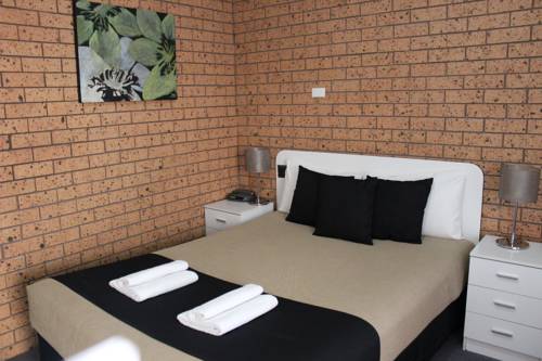 Imagen de la habitación del Hotel Golden Harvest Motor Inn. Foto 3