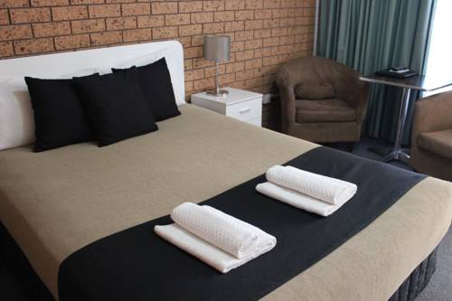 Imagen de la habitación del Hotel Golden Harvest Motor Inn. Foto 4