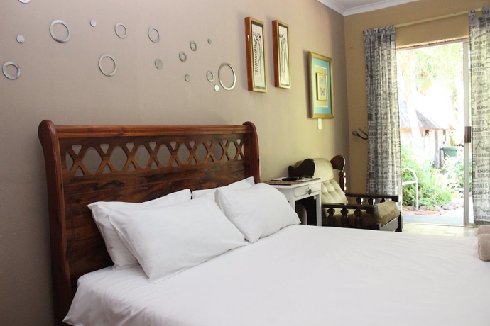 Imagen de la habitación del Hotel Golden Lantern Guest Lodge. Foto 7