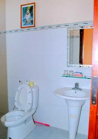 Imagen de la habitación del Hotel Golden Leaf Homestay. Foto 10