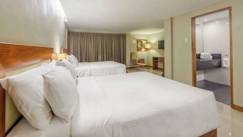 Imagen de la habitación del Hotel Golden Palm Resort. Foto 16