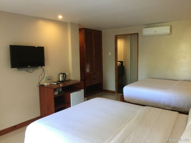 Imagen de la habitación del Hotel Golden Palm Resort. Foto 17