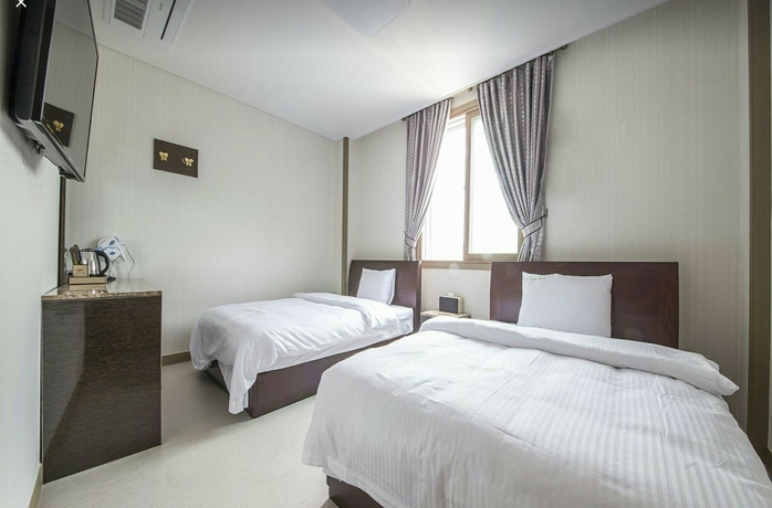 Imagen de la habitación del Hotel Golden Park, Jeju. Foto 11