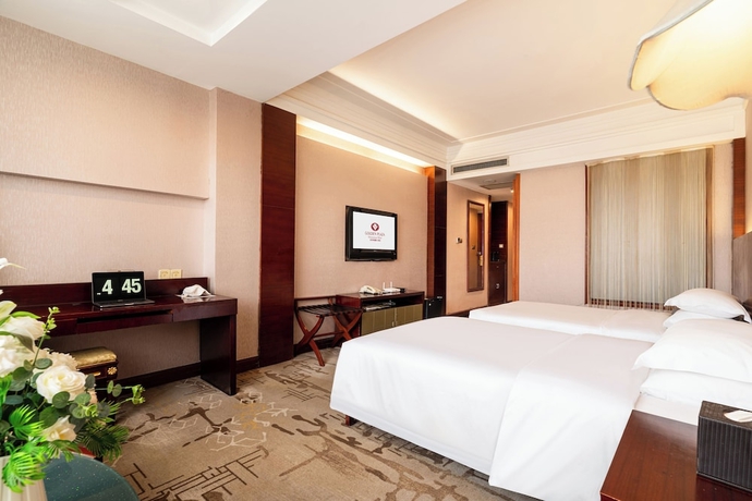Imagen de la habitación del Hotel Golden Plaza International. Foto 11