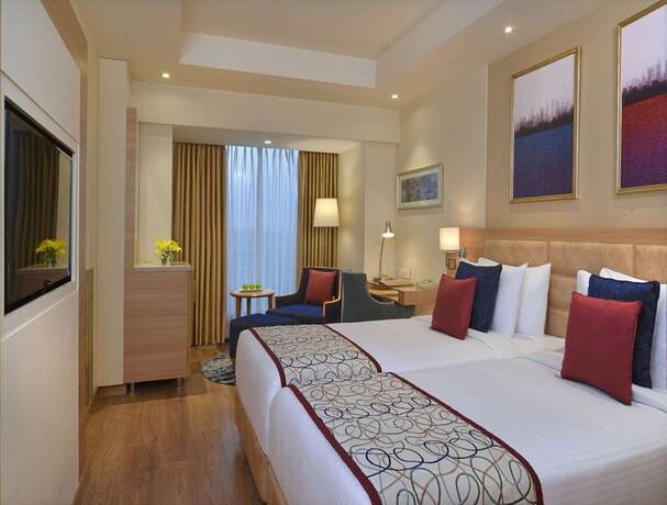 Imagen de la habitación del Hotel Golden Sarovar Portico Amritsar. Foto 19