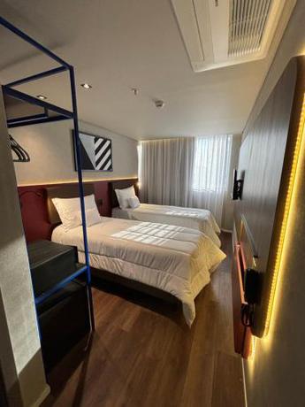 Imagen de la habitación del Hotel Golden Tower Express Na&ccedil;&otilde;es Unidas by F&ecirc;nix Hot&eacute;is. Foto 20