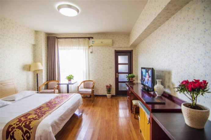 Imagen de la habitación del Hotel Golden Tree Business. Foto 8