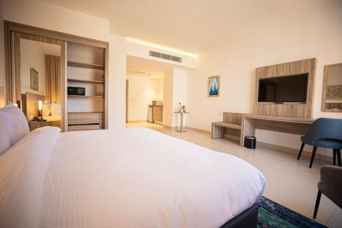 Imagen de la habitación del Hotel Golden Tulip Amman. Foto 13