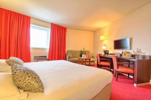 Imagen de la habitación del Hotel Golden Tulip CDG Airport Roissy. Foto 14