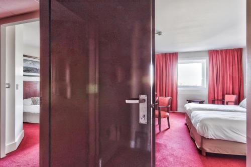 Imagen de la habitación del Hotel Golden Tulip CDG Airport Roissy. Foto 16