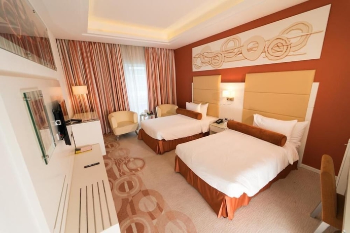 Imagen de la habitación del Hotel Golden Tulip Downtown Abu Dhabi. Foto 10