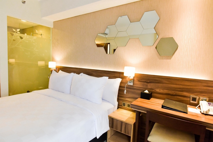 Imagen de la habitación del Hotel Golden Tulip Essential Tangerang. Foto 10