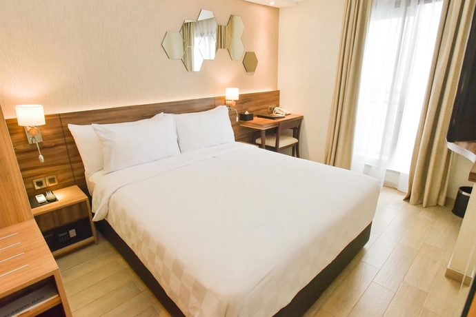 Imagen de la habitación del Hotel Golden Tulip Essential Tangerang. Foto 11