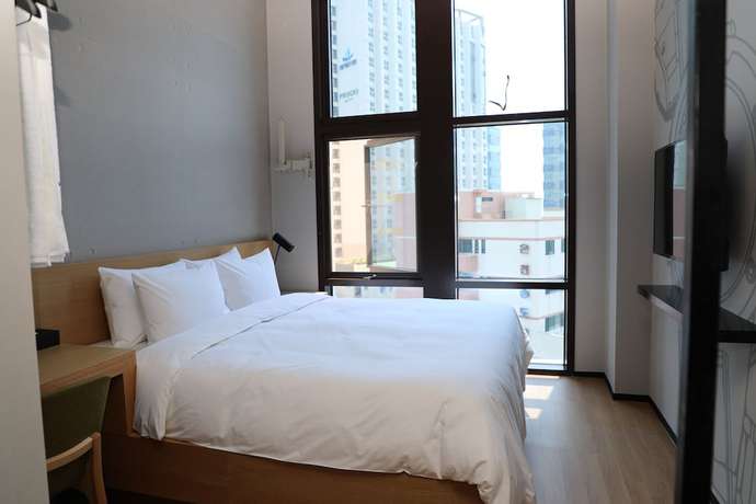 Imagen de la habitación del Hotel Golden Tulip Haeundae Hotel and Suites. Foto 19
