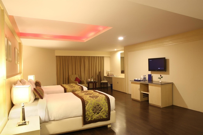 Imagen de la habitación del Hotel Golden Tulip Jaipur. Foto 11