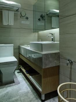 Imagen de la habitación del Hotel Golden Tulip K-land Suzhou Residence. Foto 11