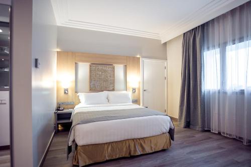 Imagen de la habitación del Hotel Golden Tulip Le Diplomate Cotonou. Foto 8