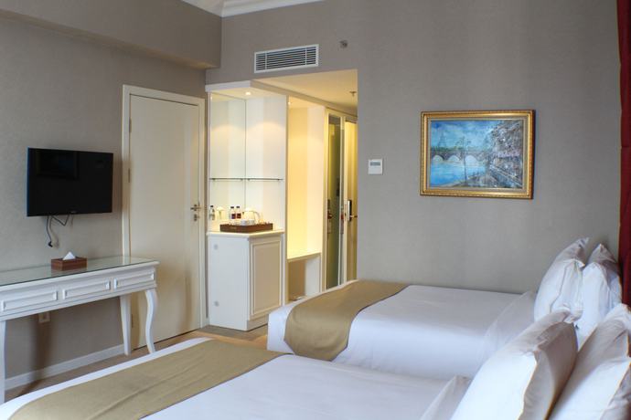 Imagen de la habitación del Hotel Golden Tulip Legacy Surabaya. Foto 12