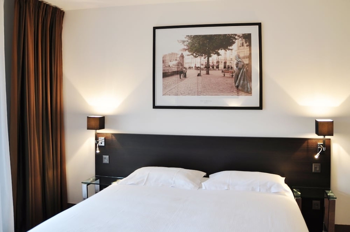 Imagen de la habitación del Hotel Golden Tulip Nantes Carquefou Suites. Foto 11