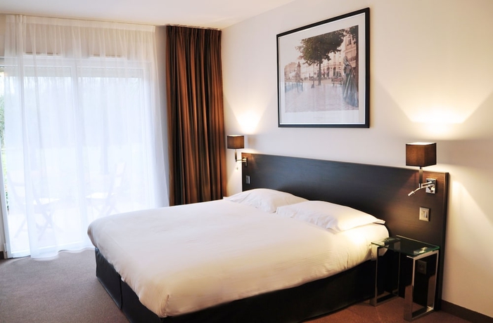 Imagen de la habitación del Hotel Golden Tulip Nantes Carquefou Suites. Foto 12