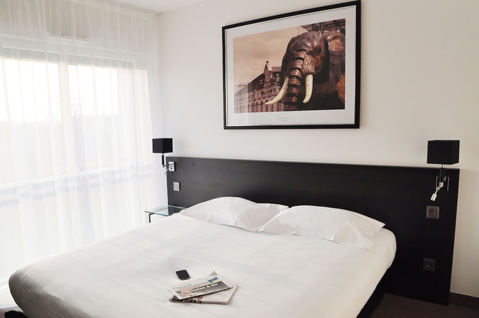 Imagen de la habitación del Hotel Golden Tulip Nantes Carquefou Suites. Foto 18