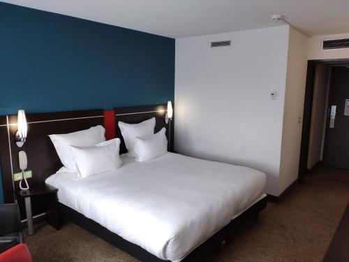 Imagen de la habitación del Hotel Golden Tulip Roissy Saint Witz. Foto 12