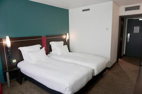 Imagen de la habitación del Hotel Golden Tulip Roissy Saint Witz. Foto 13