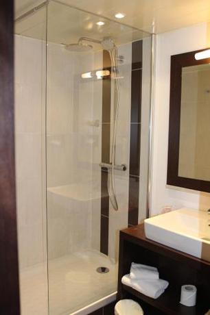 Imagen de la habitación del Hotel Golden Tulip Roissy Saint Witz. Foto 15