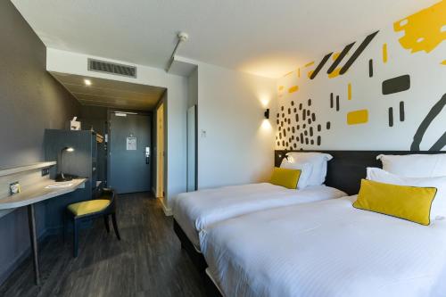 Imagen de la habitación del Hotel Golden Tulip Roissy Saint Witz. Foto 16