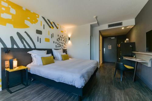 Imagen de la habitación del Hotel Golden Tulip Roissy Saint Witz. Foto 17