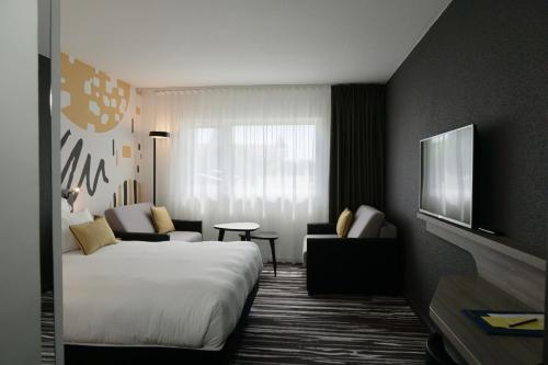 Imagen de la habitación del Hotel Golden Tulip Roissy Saint Witz. Foto 18