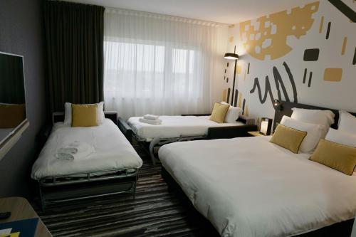 Imagen de la habitación del Hotel Golden Tulip Roissy Saint Witz. Foto 19