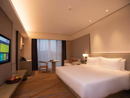 Imagen de la habitación del Hotel Golden Tulip Xuzhou Huaihai. Foto 14
