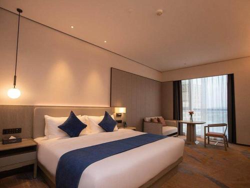 Imagen de la habitación del Hotel Golden Tulip Xuzhou Huaihai. Foto 15