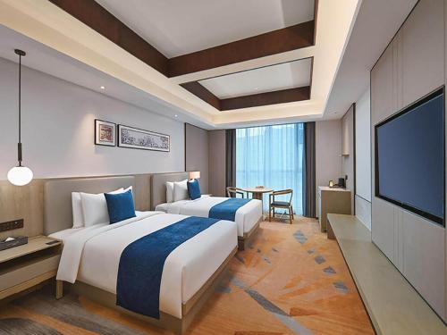 Imagen de la habitación del Hotel Golden Tulip Xuzhou Huaihai. Foto 16