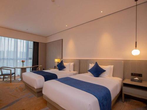 Imagen de la habitación del Hotel Golden Tulip Xuzhou Huaihai. Foto 17