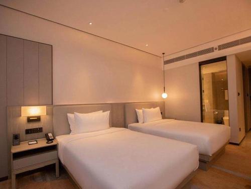 Imagen de la habitación del Hotel Golden Tulip Xuzhou Huaihai. Foto 18