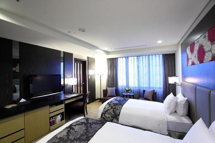 Imagen de la habitación del Hotel Golden Tulip Zhong Xin. Foto 8
