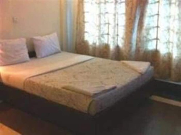 Imagen de la habitación del Hotel Golden World Guesthouse. Foto 13