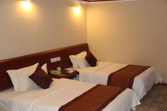 Imagen de la habitación del Hotel Golden Zone Hotel - Xishuangbanna. Foto 3