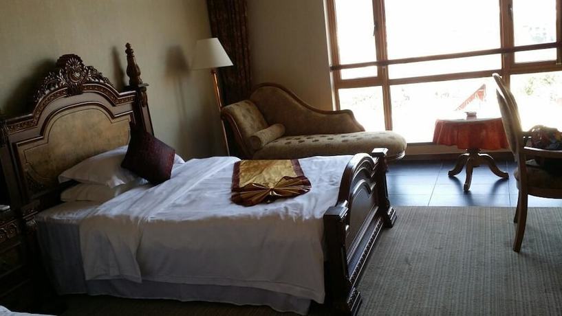 Imagen de la habitación del Hotel Golden Zone Hotel - Xishuangbanna. Foto 4