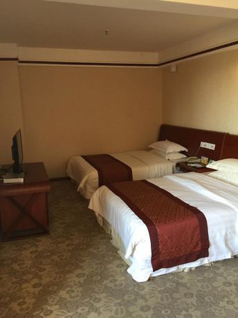 Imagen de la habitación del Hotel Golden Zone Hotel - Xishuangbanna. Foto 5