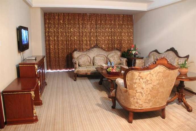 Imagen de la habitación del Hotel Golden Zone Hotel - Xishuangbanna. Foto 7