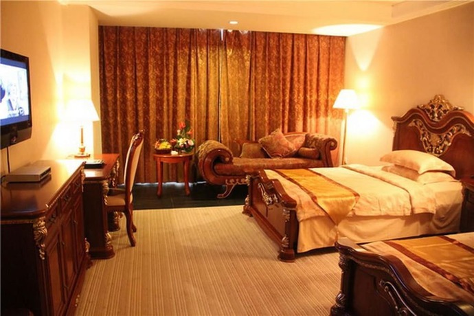 Imagen de la habitación del Hotel Golden Zone Hotel - Xishuangbanna. Foto 13