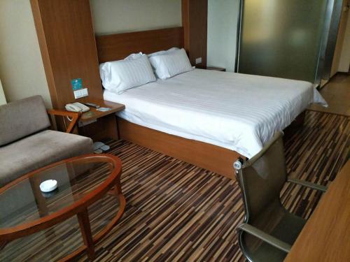 Imagen de la habitación del Hotel Goldmet Inn Taiyuan Dananamen. Foto 5