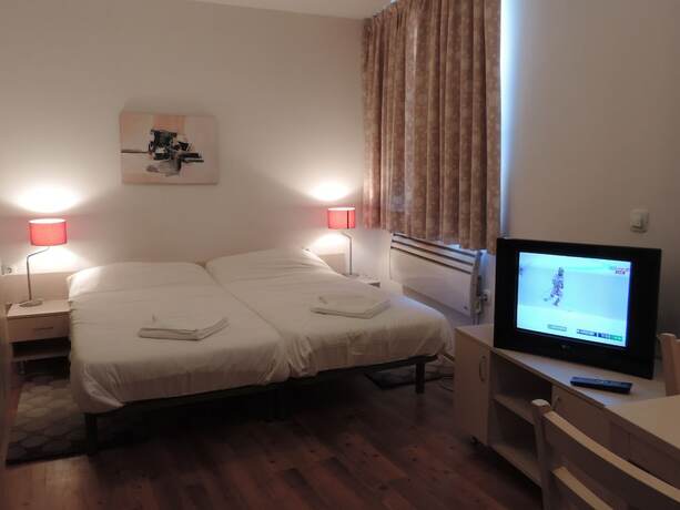 Imagen de la habitación del Hotel Gondola Apartments and Suites. Foto 19