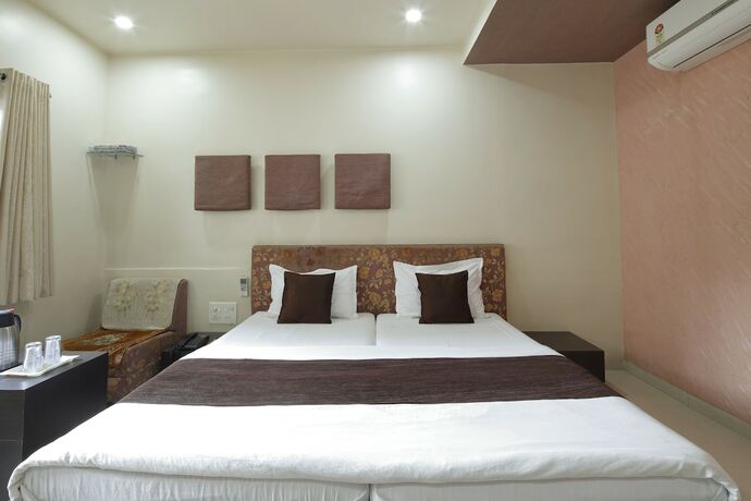 Imagen de la habitación del Hotel Good Night, Ahmedabad. Foto 24